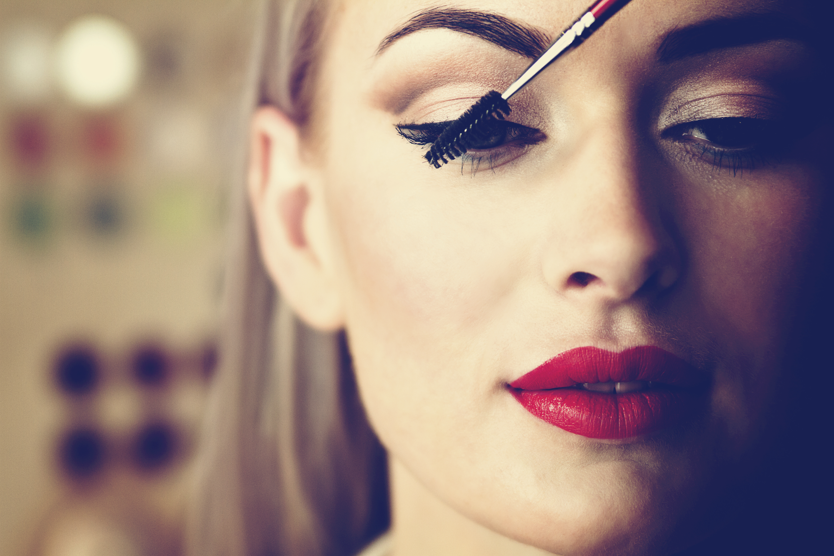 blonde paints eyelashes