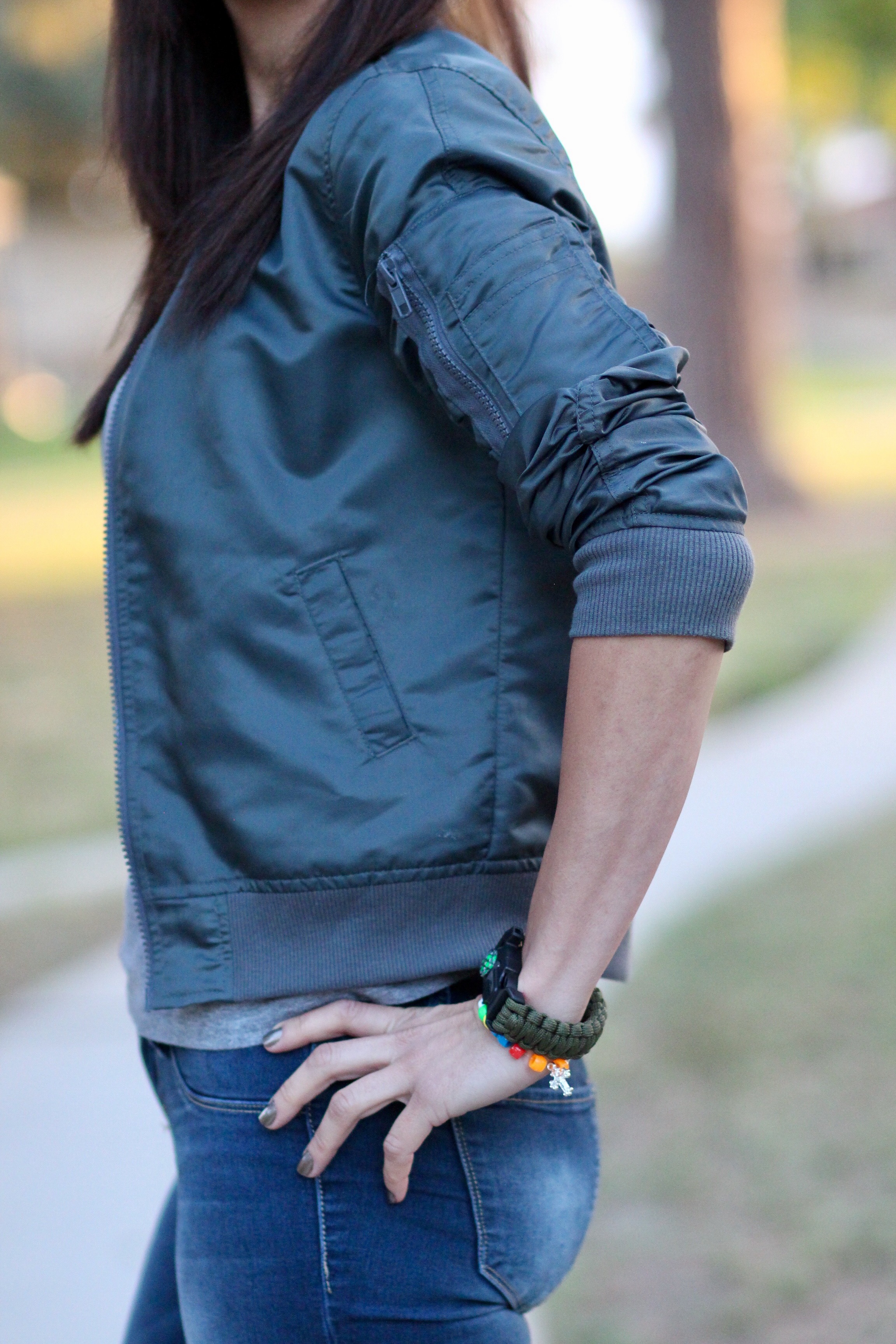 Bomber jacket with sleeve zipper detail and compass watch