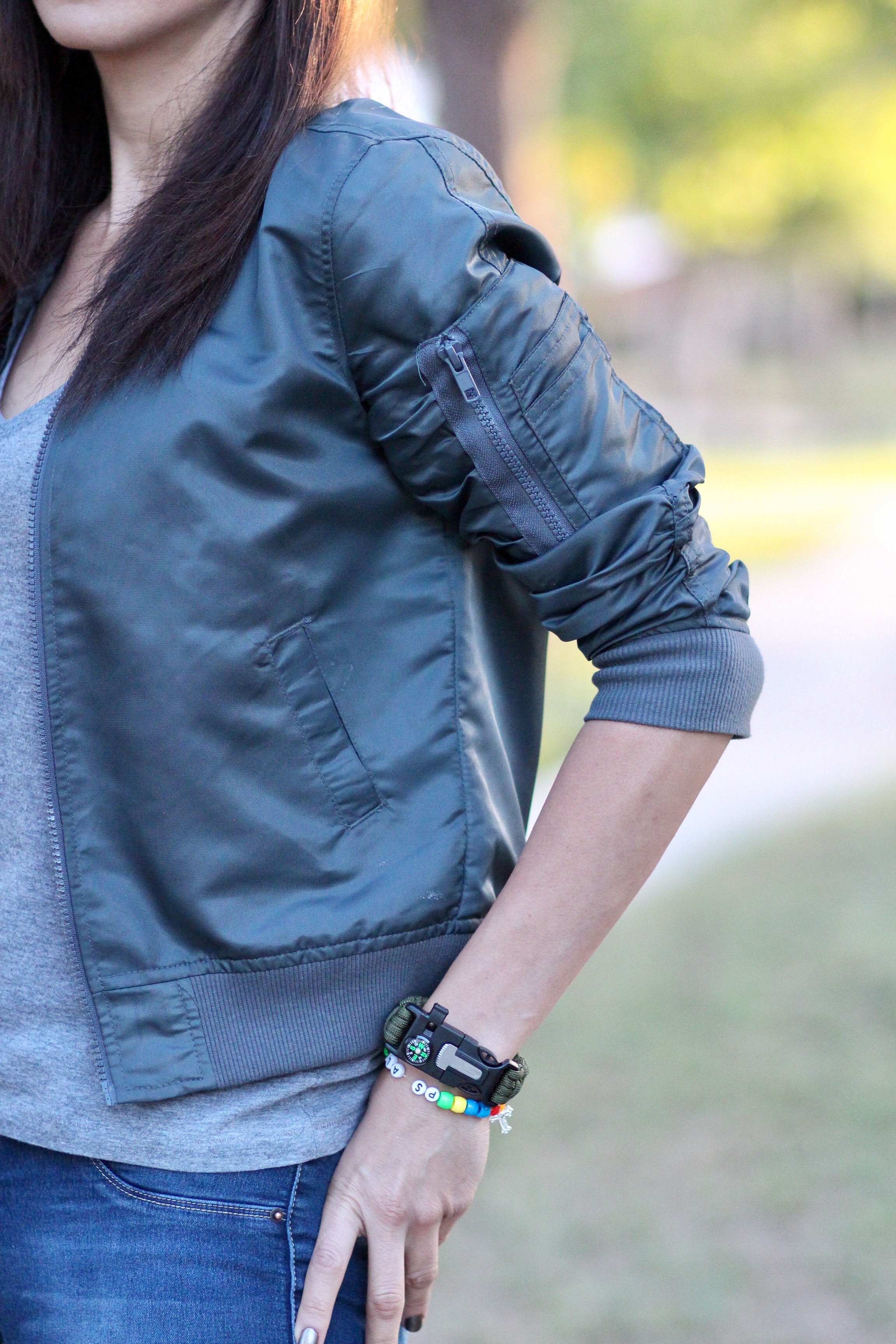 Bomber jacket with sleeve zipper detail and compass watch