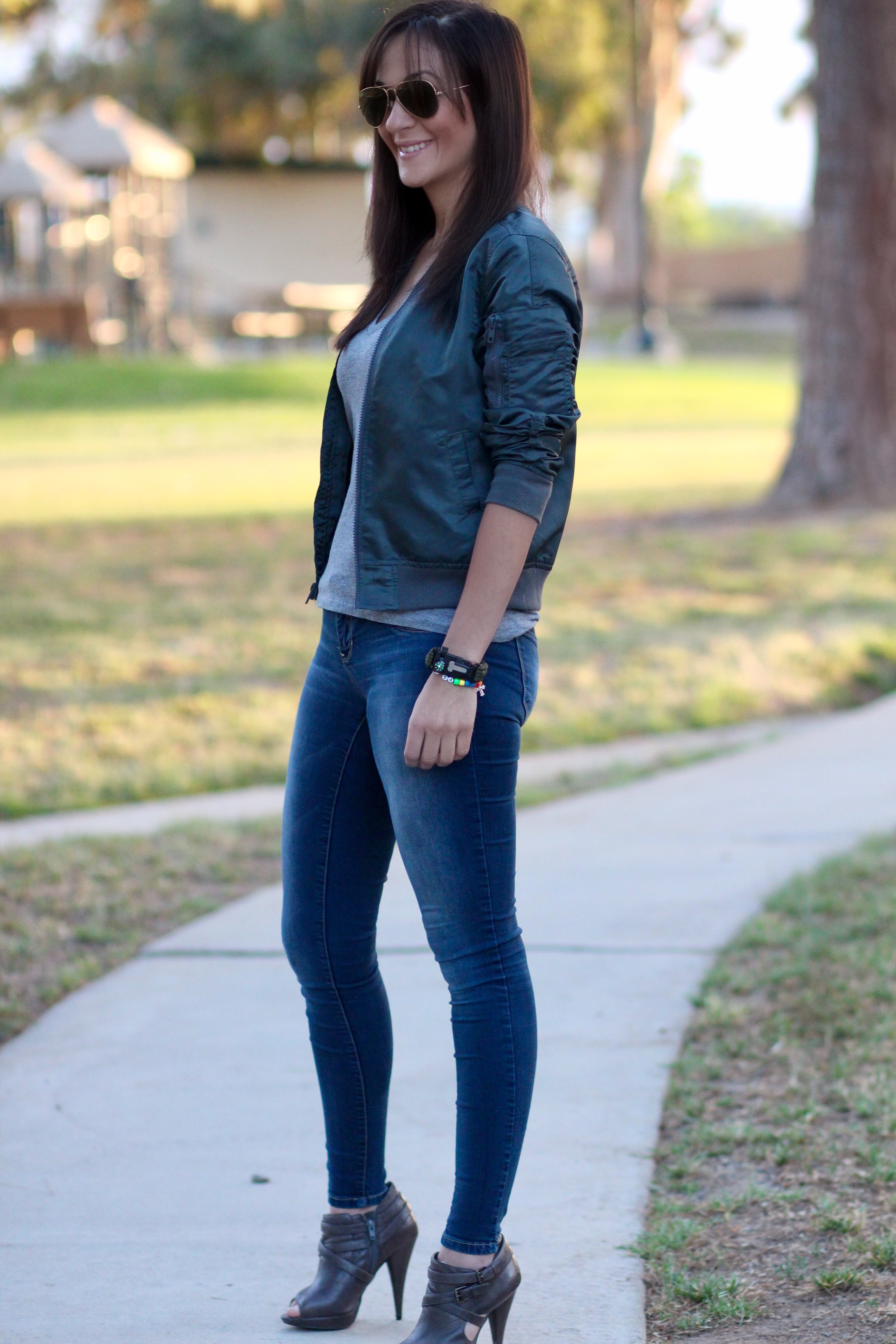 Fashion blogger Marianne Harper in bomber jacket and booties